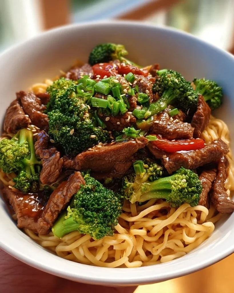 Delicious Beef and Broccoli Noodles served with fresh vegetables