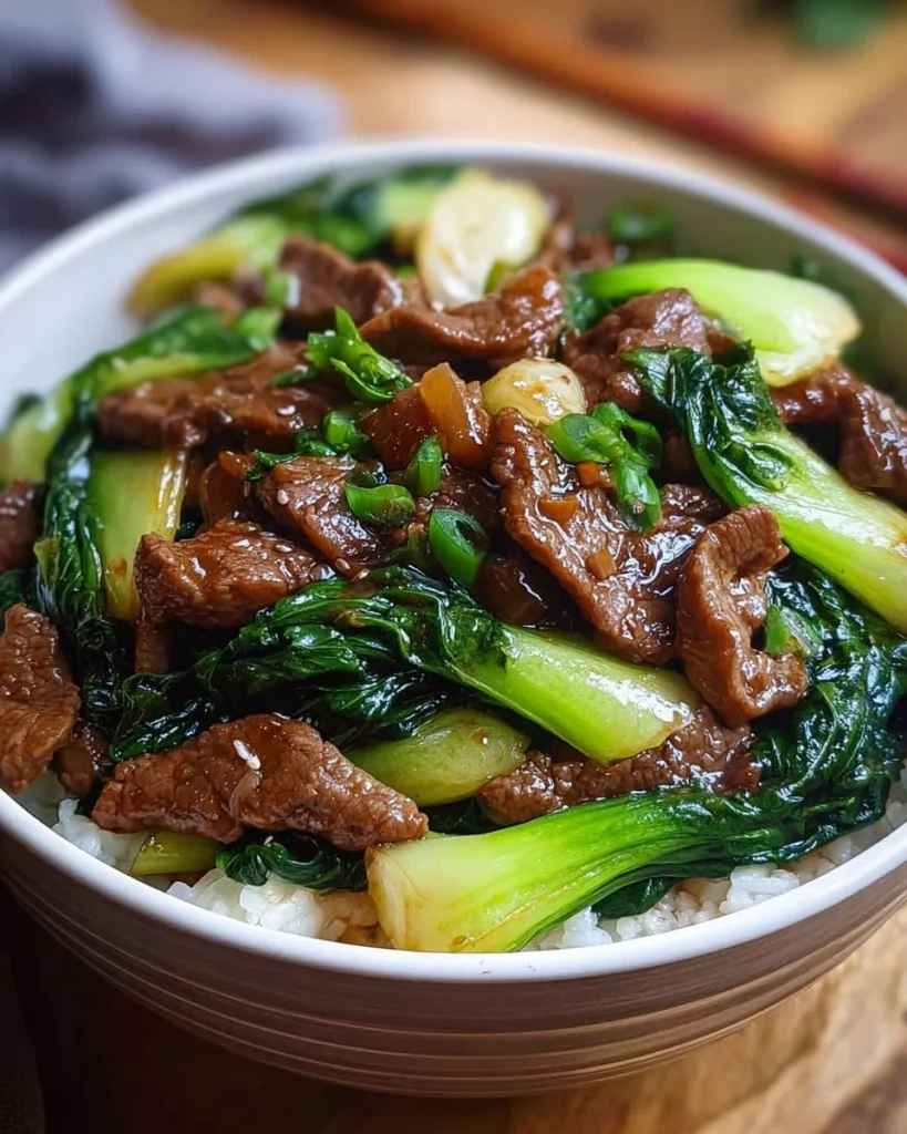 Savory beef stir-fry with bok choy and vegetables in a skillet