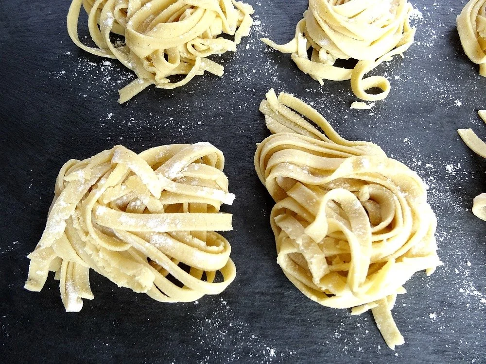 Two-ingredient gluten-free pasta dough on a wooden surface